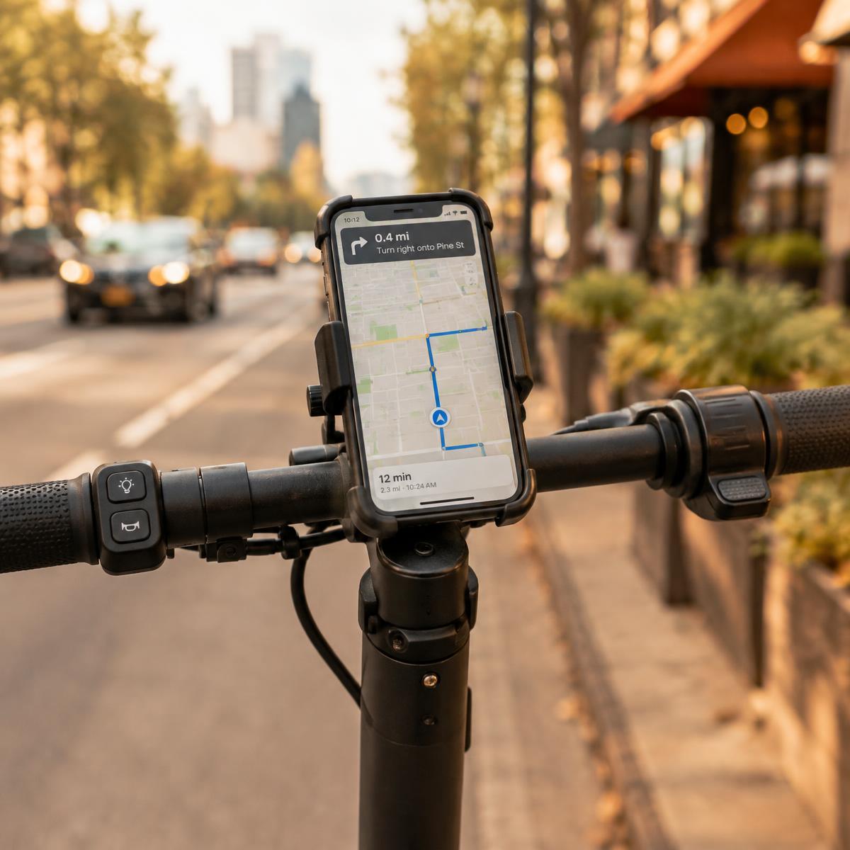 Smartphone showing a map held in a phone mount on scooter handlebars